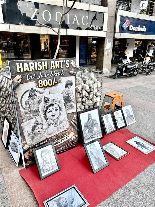 Harish Art street display with framed sketches in Noida
