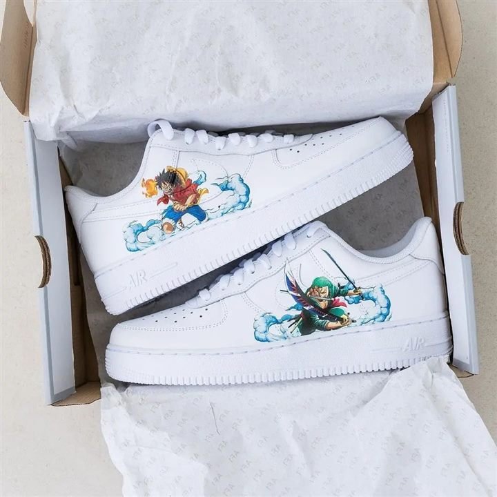 White sneakers with small hand-painted character illustrations