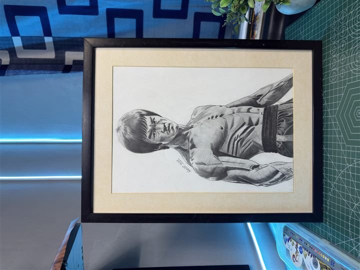 Framed pencil and charcoal portrait inspired by martial arts cinema